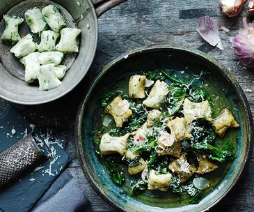 Gnudi with wilted bitter greens