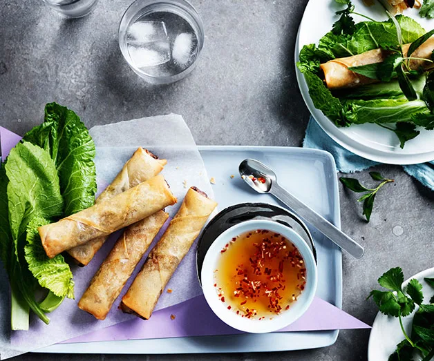 Vietnamese spring rolls with mustard leaves and herbs
