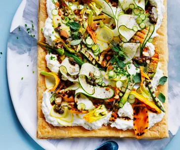 Salted ricotta tart with zucchini and black garlic