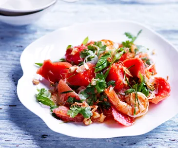 Sweet and sour watermelon salad with pink grapefruit and prawns