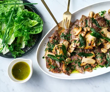 steak-topped-with-mushrooms-and-a-side-salad