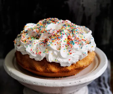 Ciaramicola cake topped with Italian meringue and sprinkles
