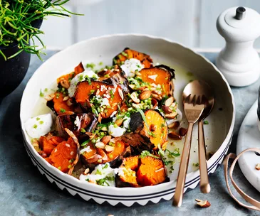 Sweet potato roasted in a bowl topped with goat's curd