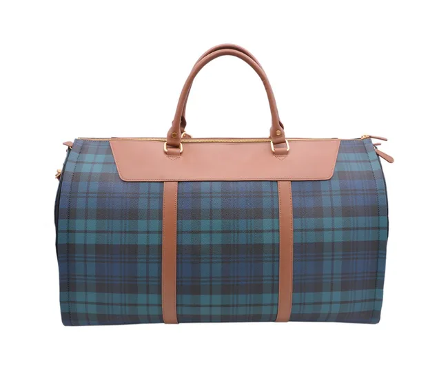 Blue and green plaid duffle bag with tan leather handles and accents on a white background.