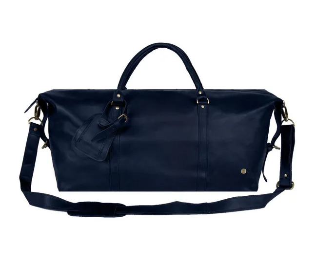 Dark blue leather duffle bag with handles, a shoulder strap, and a luggage tag attached.