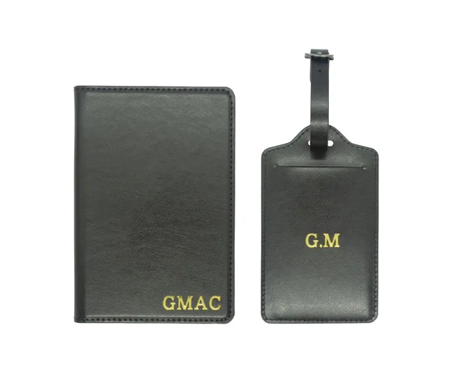 Black leather passport holder and luggage tag with gold initials "GMAC" and "G.M" printed on them.
