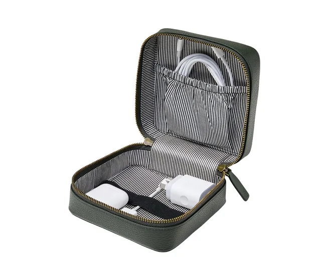 Open green travel case with chargers and cables inside on striped lining.