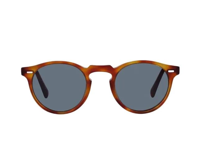 Brown round sunglasses with dark lenses and thin temples on a white background.