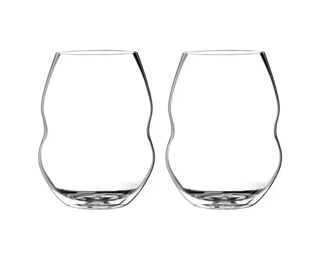 Pair of clear Riedel O Syrah wine glasses with a wavy design on a plain white background.