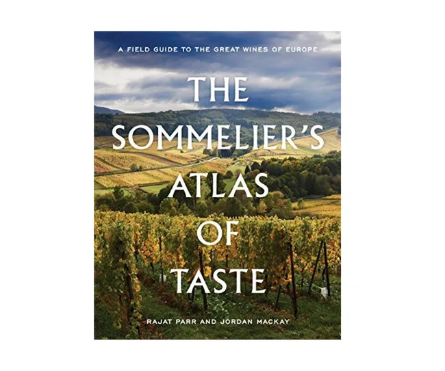 Cover of "The Sommelier's Atlas of Taste" by Rajat Parr and Jordan MacKay, featuring a vineyard landscape.