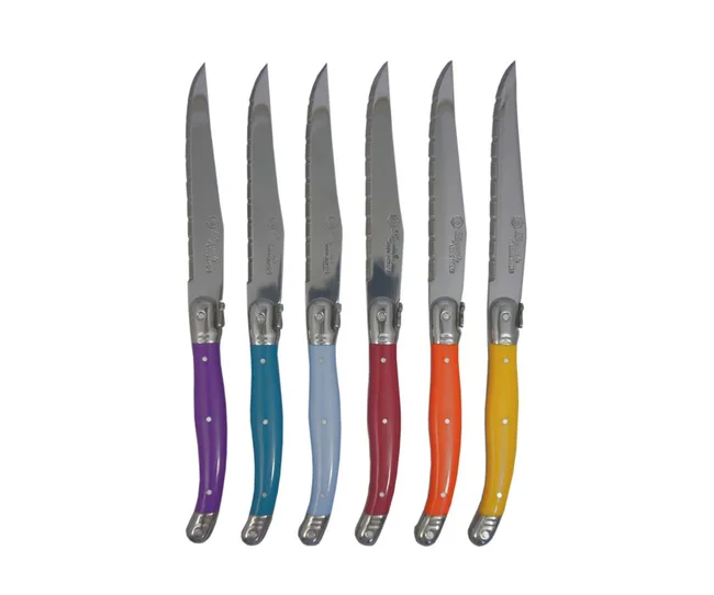 Set of six steak knives with multicolored handles: purple, teal, light blue, red, orange, and yellow.