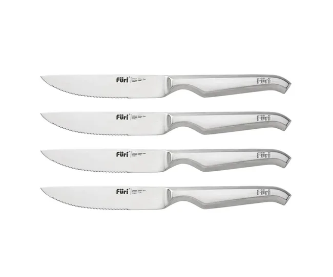 Set of four stainless steel Füri steak knives with serrated edges and ergonomic handles, arranged horizontally.
