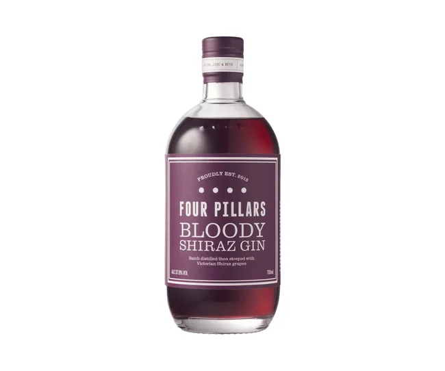 Four Pillars Bloody Shiraz Gin bottle with purple label on white background.