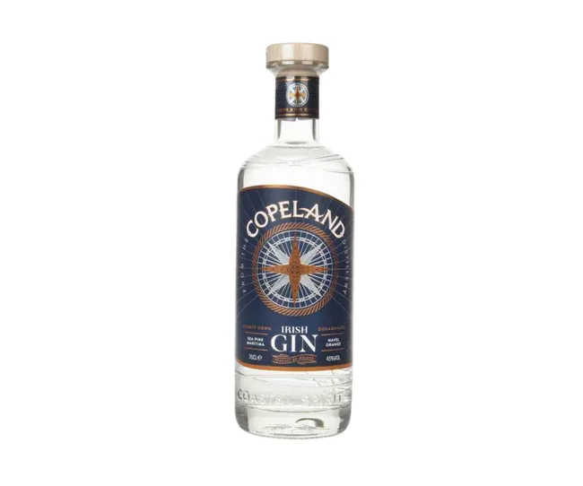 Copeland Irish Gin bottle with blue and gold label featuring a compass design.