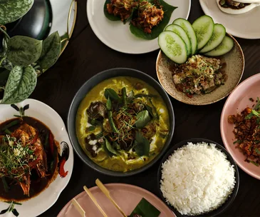Jungle Fowl in Port Douglas Queensland. Photo of Bowls of curry, rice and salads