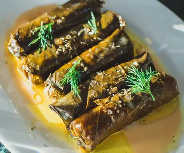 Yiamas restaurant in Perth WA. Photo of dolmades cabbage rolls sprinkled with dill and covered in sauce
