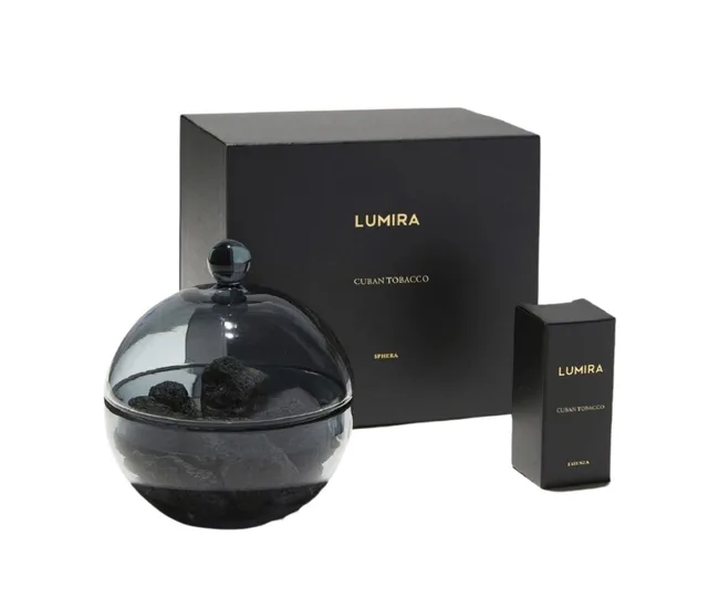 Black Lumira Cuban Tobacco candle packaging with glass dome and rocks.