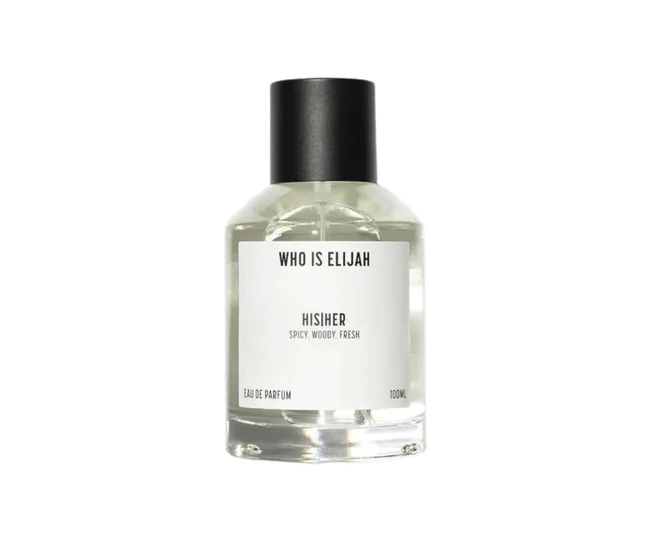 "Clear glass bottle of 'Who is Elijah' His/Her Eau de Parfum with a black cap, labeled spicy, woody, fresh scent."