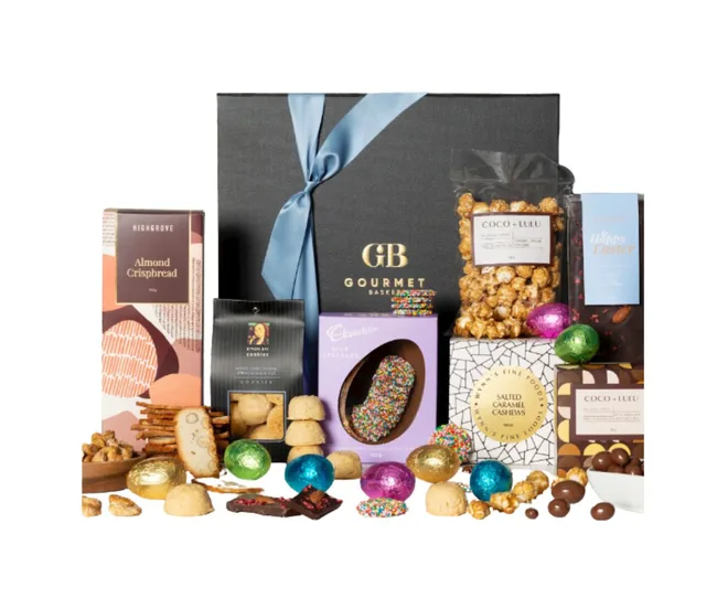 Luxury gift hamper with assorted snacks, chocolates, biscuits, and nuts, featuring a black box with a blue ribbon.