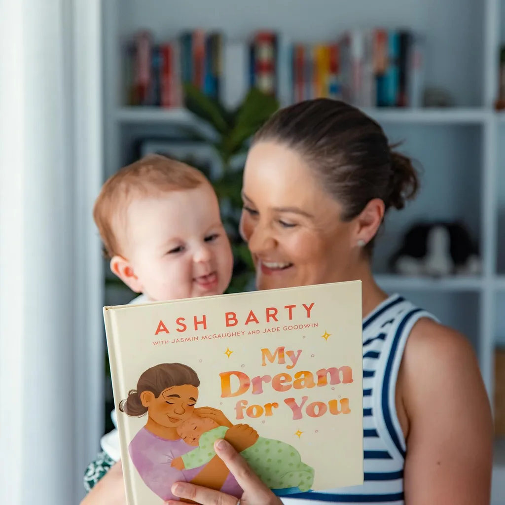 ash barty reading a book to her son