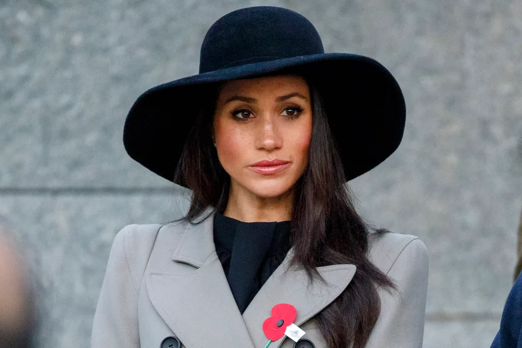 For this service, Meghan wore a wide brimmed black hat teamed with a grey trench coat believed to be a custom design by Matthew Williamson costing £1,140.