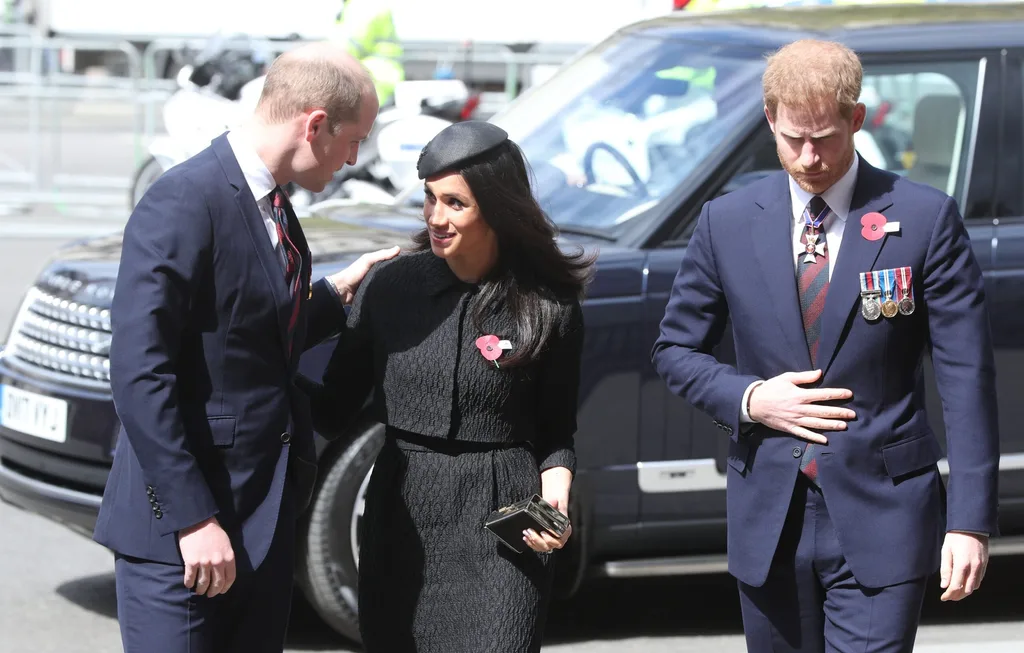 The Duke of Cambridge greets Ms Markle, accompanied by Harry, with a delicate pat on her shoulder (Jonathan Brady/PA)
