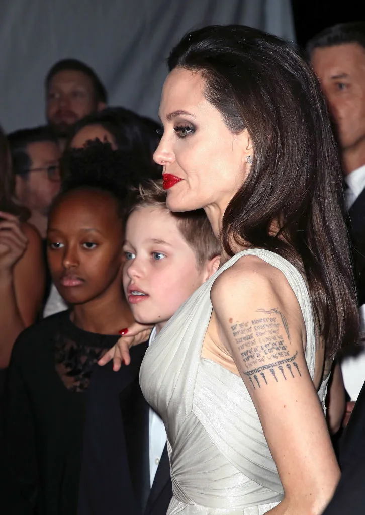 Angelina holds onto Shiloh at event