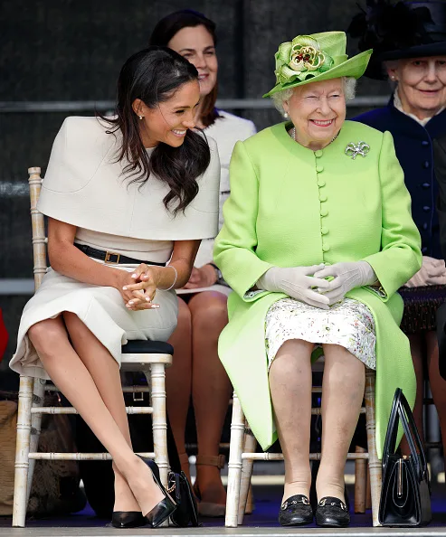 The Queen and Meghan Markle laugh together