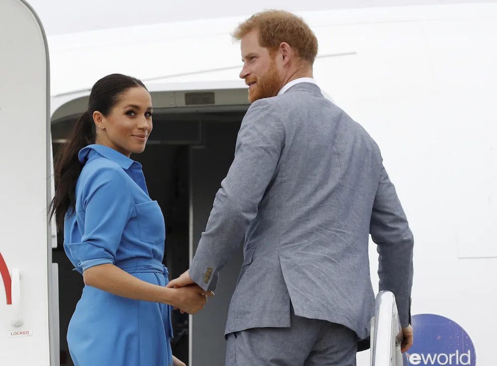 Prince harry Meghan markle fly back to australia