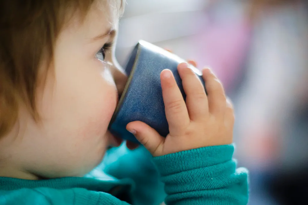 toddler with cup