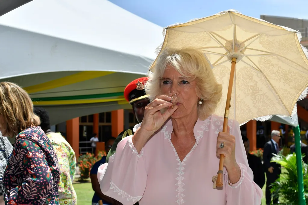 Camilla drinks rum