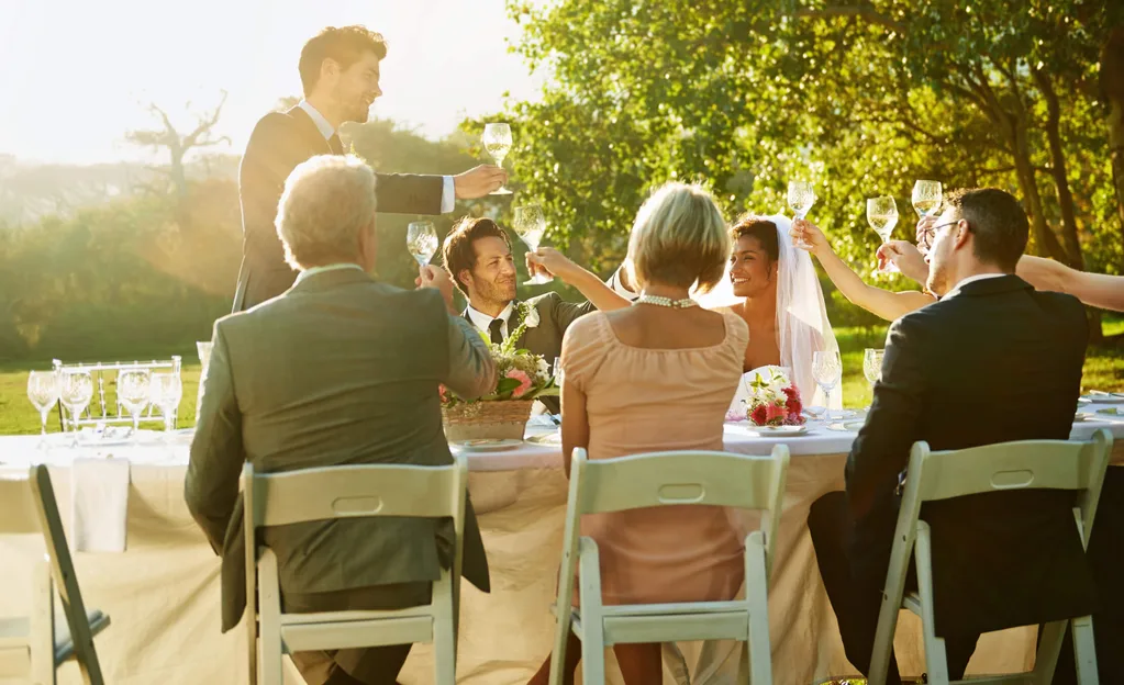 Friends toast at a wedding celebration