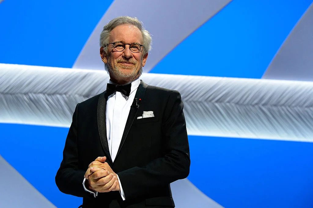 Director & Filmmaker Steven Spielberg against a blue and silver background