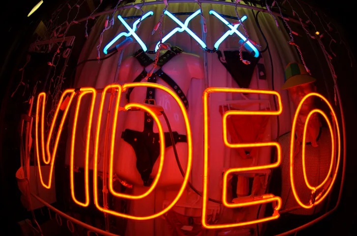 A photo of an XXX-Rated Video Sign taken with a fish eye lens