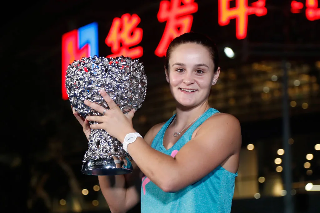 Tennis player, Ashleigh Barty, holding the 2018 WTA Elite Trophy Zhuhai