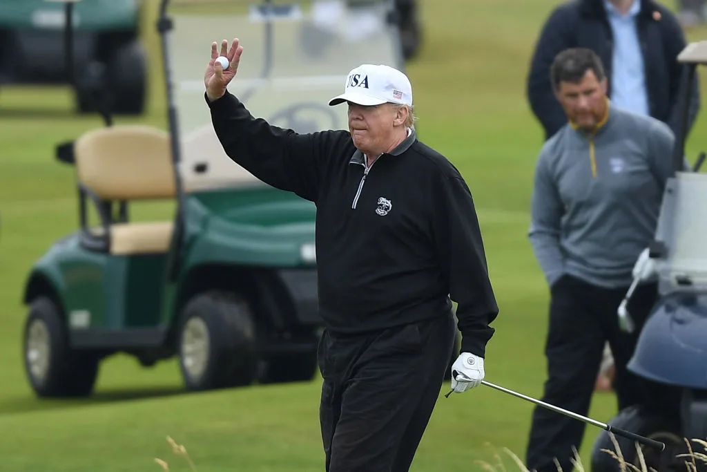 Donald Trump playing golf at the Trump Turnberry Luxury Collection Resort