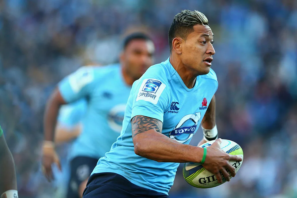 Israel Folau running with the ball during a rugby match