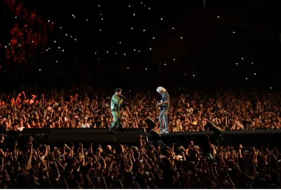 $250,000 was donated during Queen's set, bringing the total raised so far to $7.7 million.