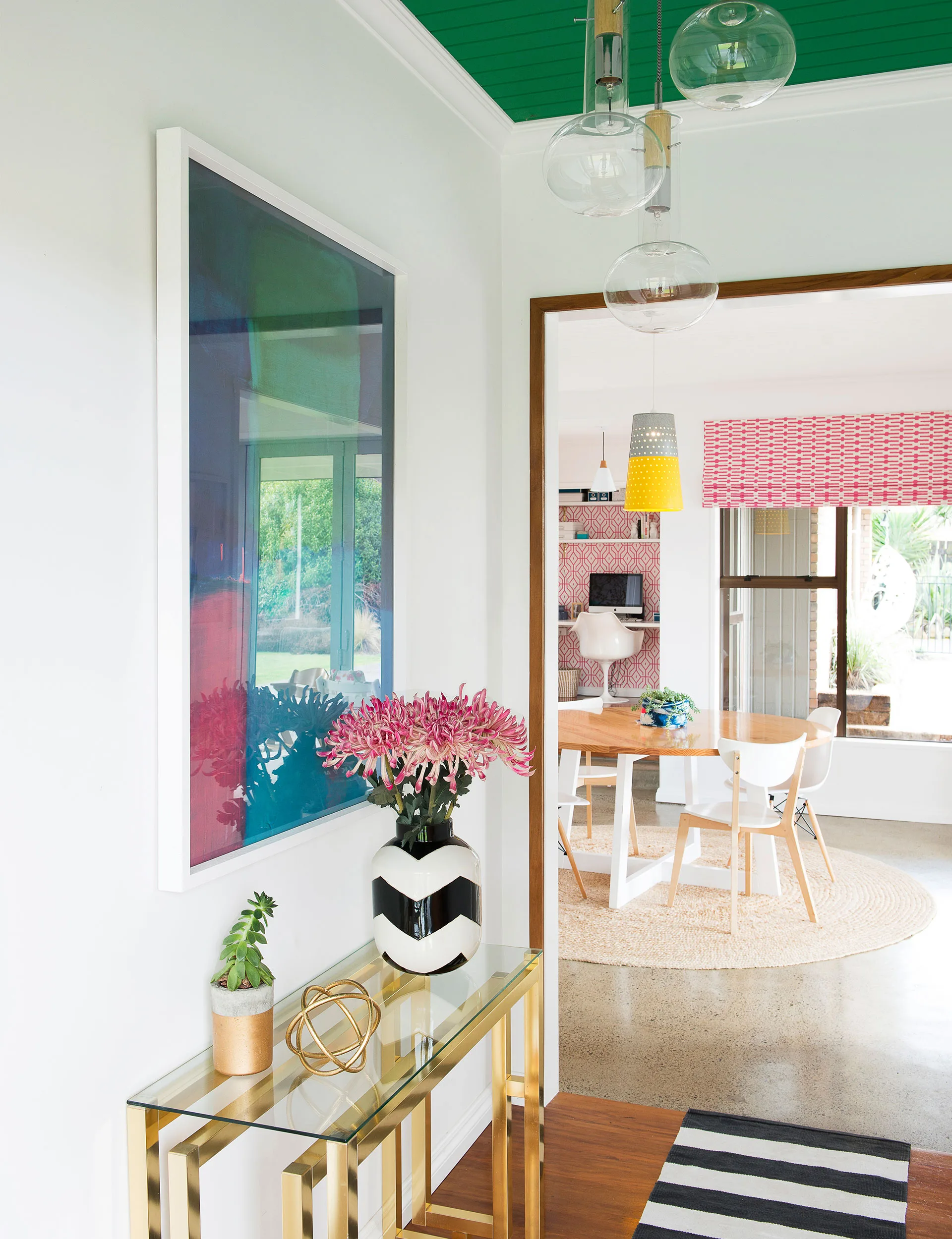 With its green ceiling, the striking entranceway is a great example of how Vic and Dael introduced Angie’s love of colour into the home.