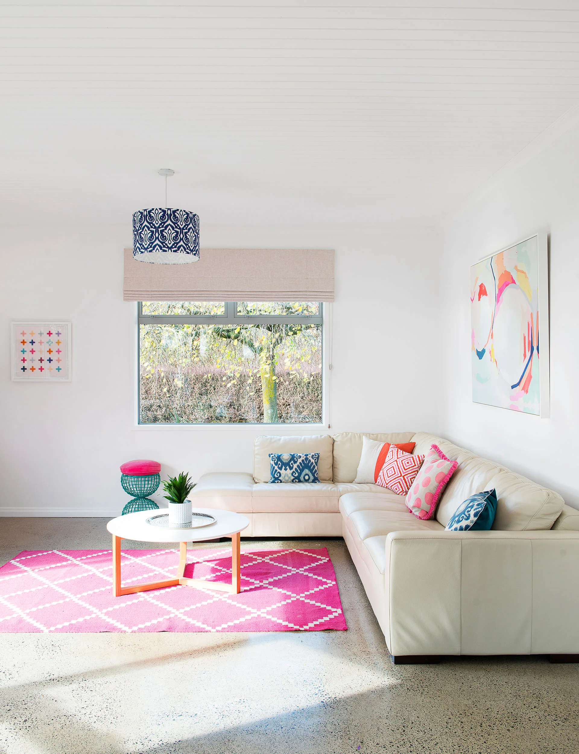 What was once an awkward space that offered little in the way of seating is now a cosy living room.