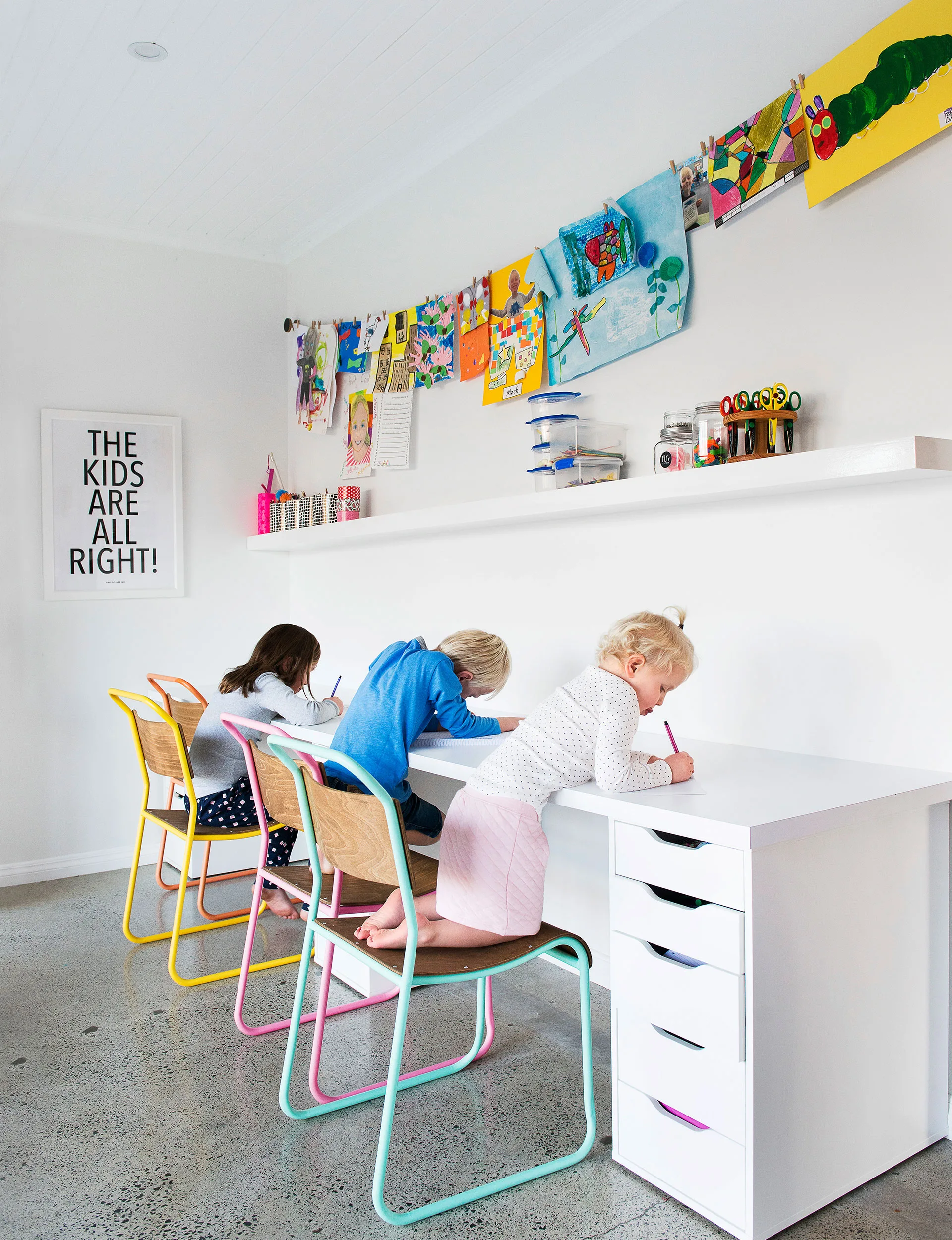 Matilda, Mack and Lulu love to draw and paint in the playroom, and the concrete floor makes for easy clean-up.