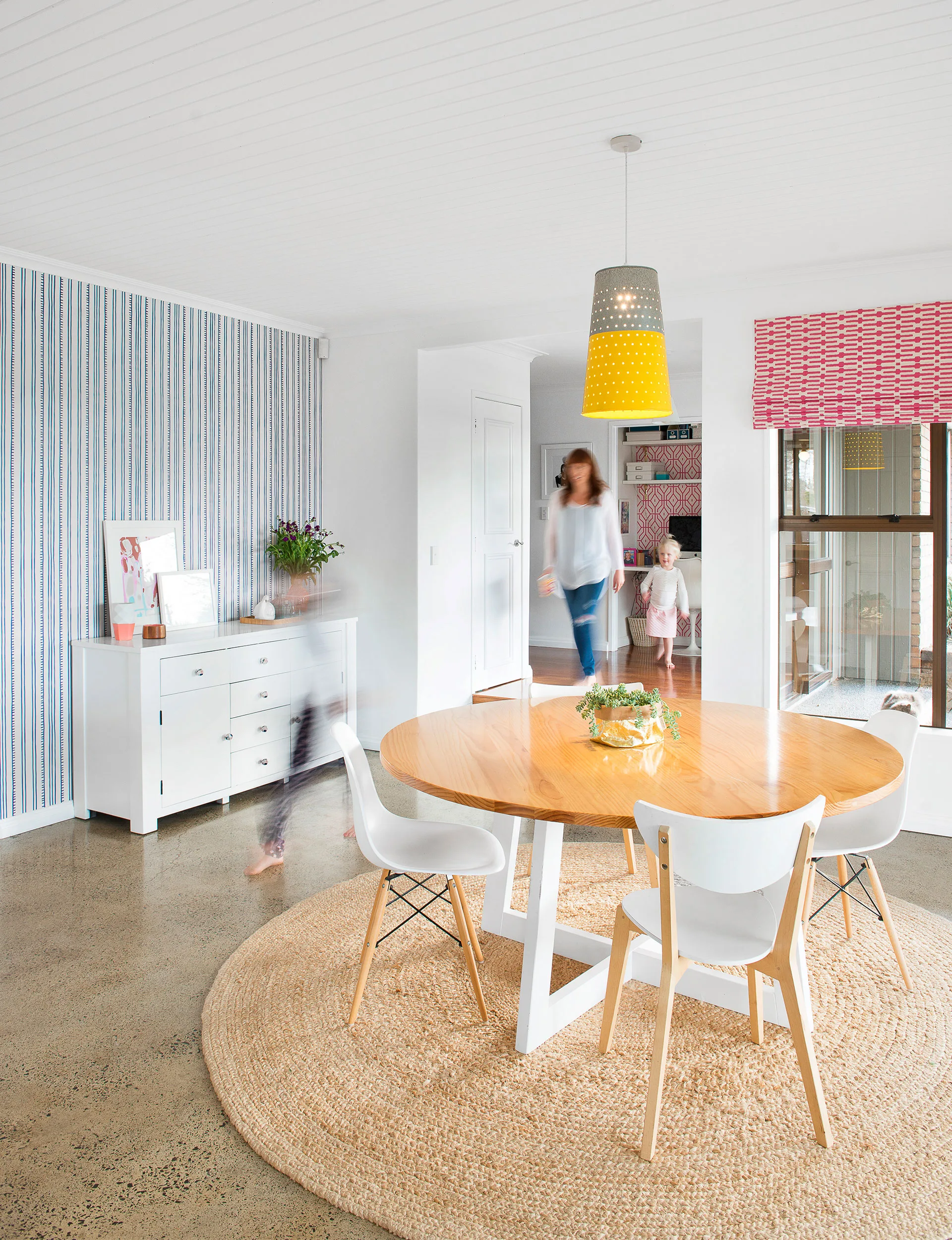 The living area and dining room (featuring an eye-catching blue ‘Higgledy Piggledy Stripe’ wallpaper by Anna Spiro) went through the biggest transformations and now get plenty of use by family and friends.
