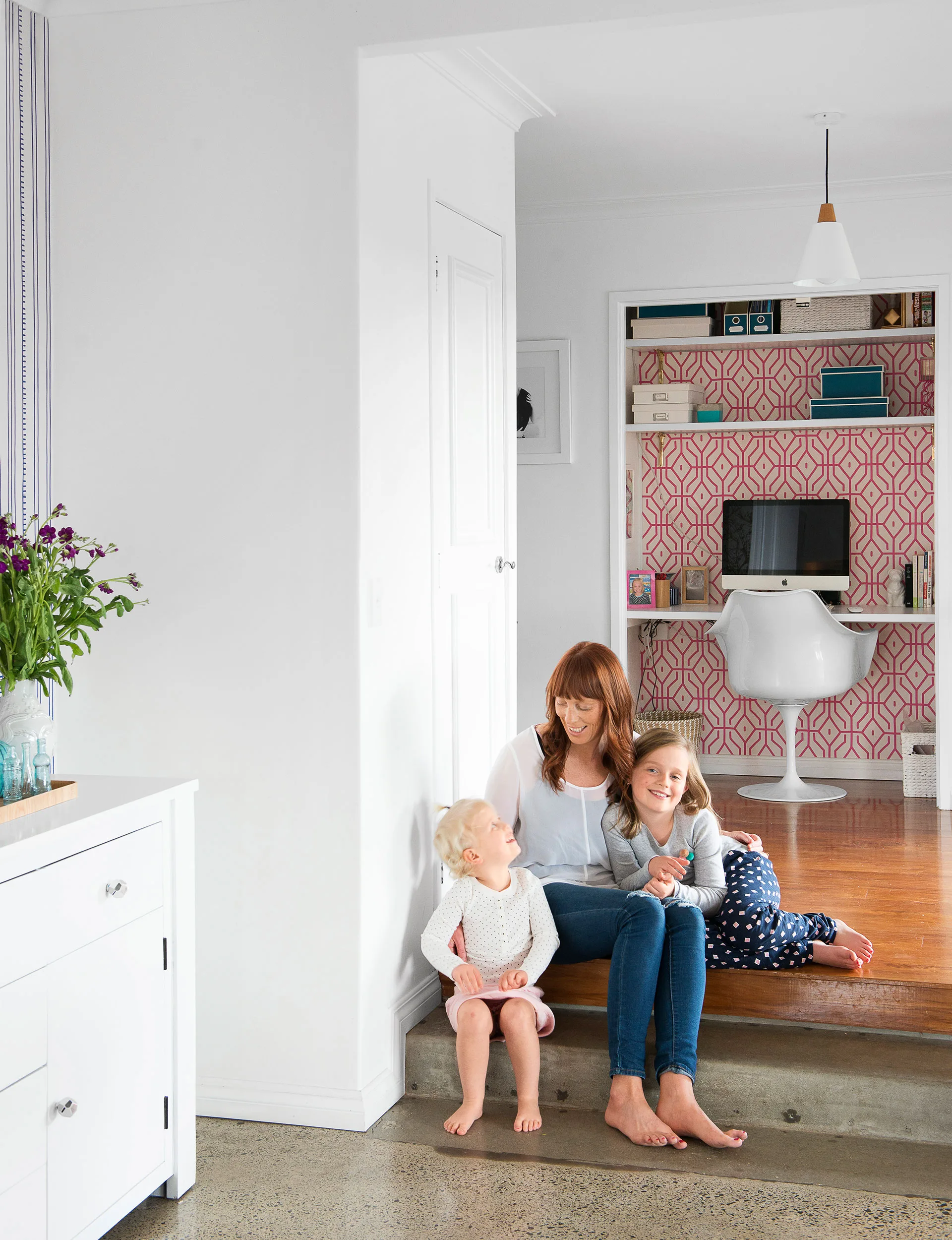 From the kitchen and study nook, two steps lead down to the light-filled dining room and the heart of the home.