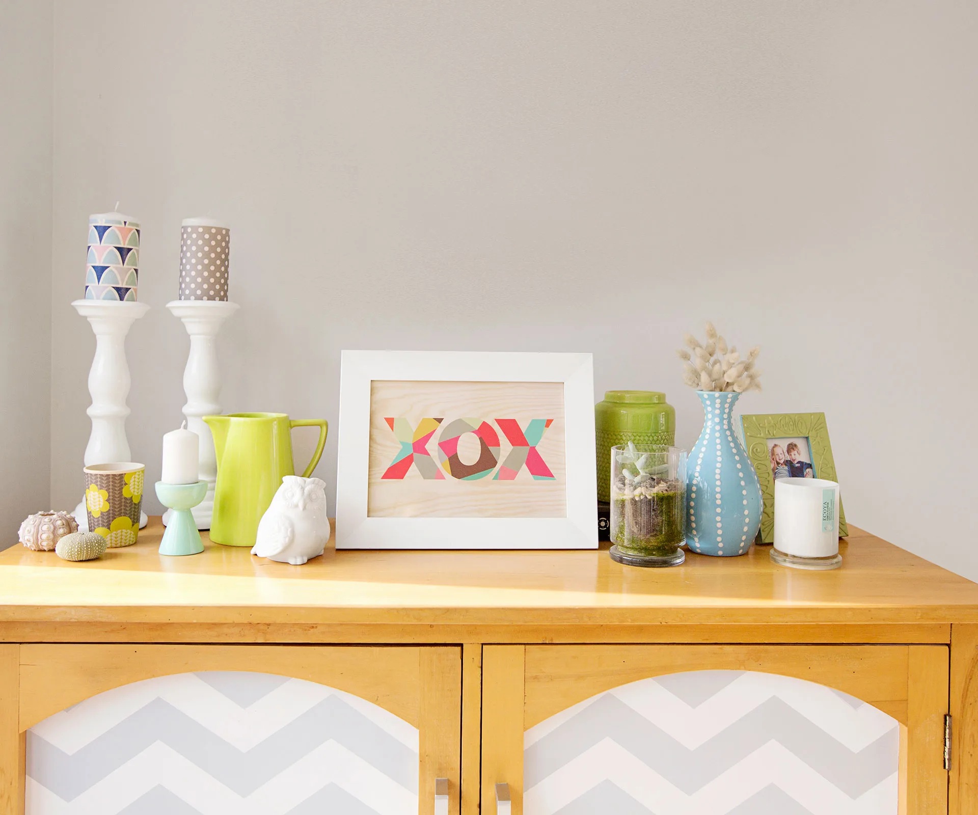 The cabinet is another Trade Me purchase given a facelift by Lisa, who painted a chevron pattern on the doors. 