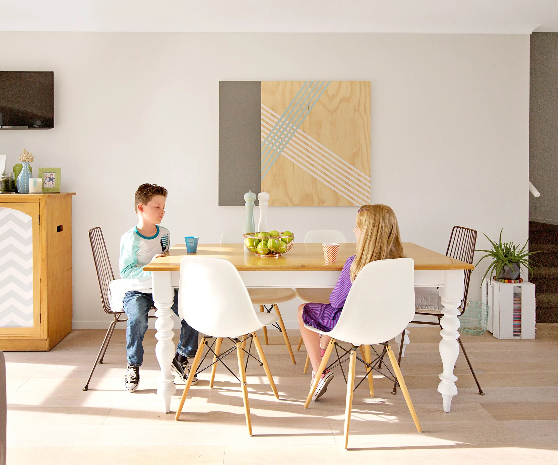 Joe and Lisa upcycled the dining table purchased on Trade Me, which harmonises with other timber elements for a cohesive look throughout the open-plan living, dining and kitchen space. 