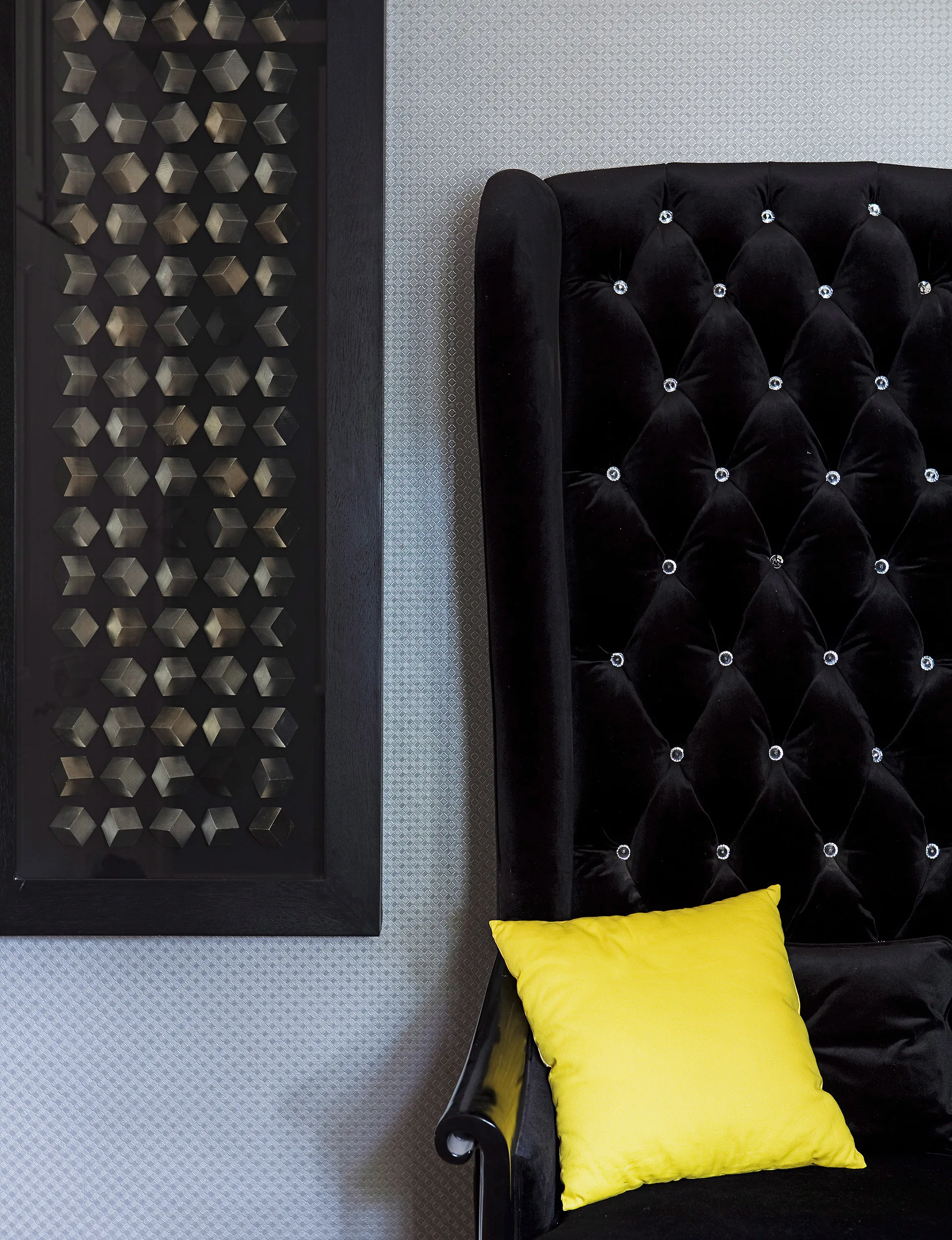 The boys chose this gorgeous velvet high-back chair for its grown-up shape and accented it with a bright yellow cushion.