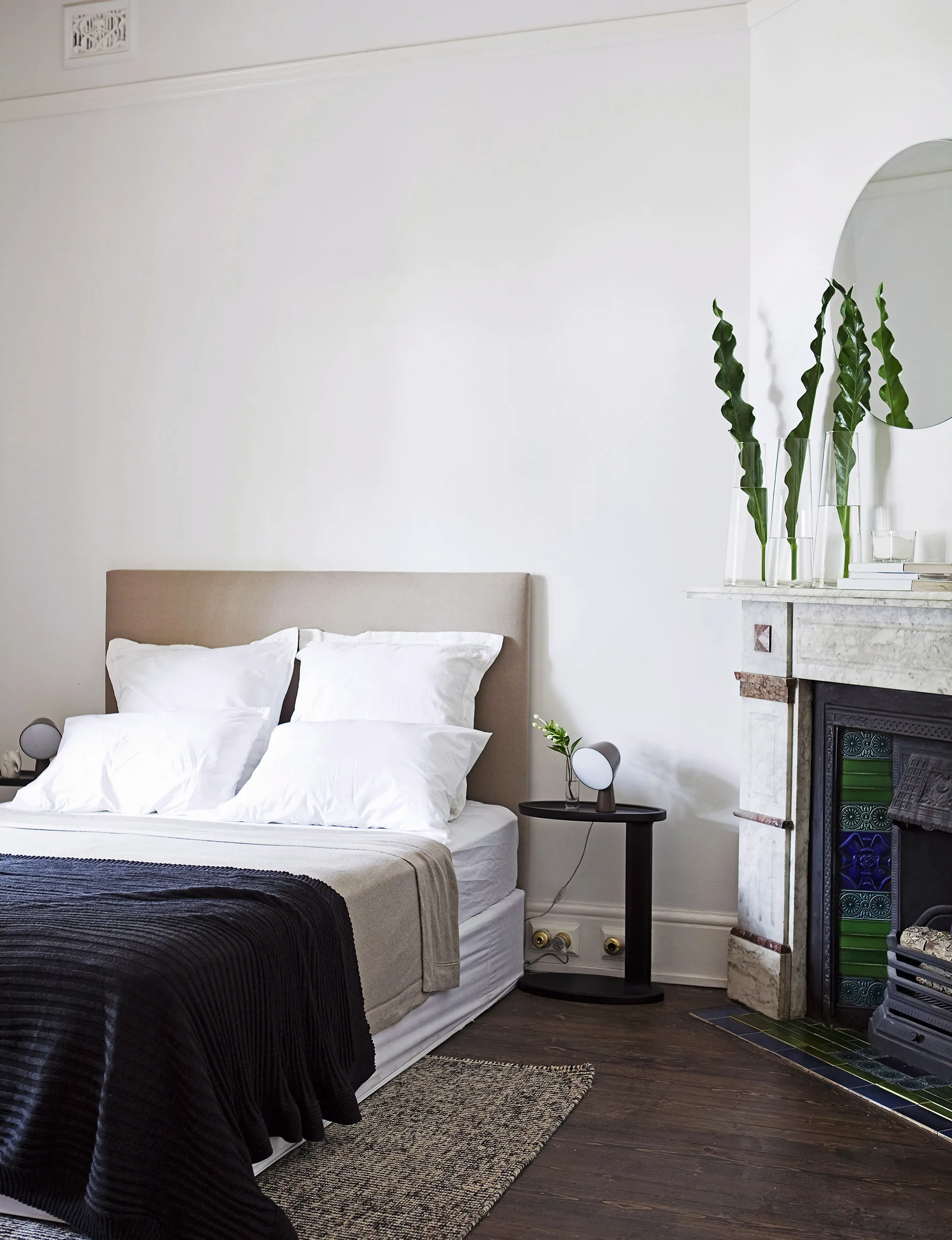 The bedhead was a bargain covered in faux doeskin from Spotlight, but it’s cleverly combined with a more high-end bedside table