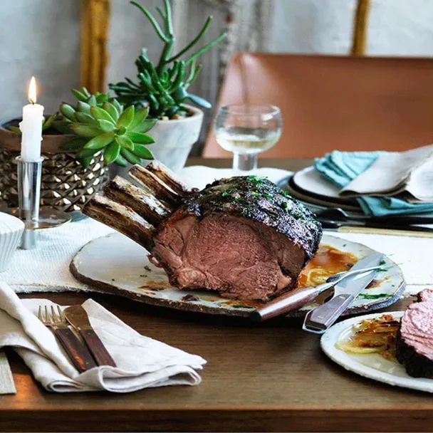 carved beef rib roast on a set table