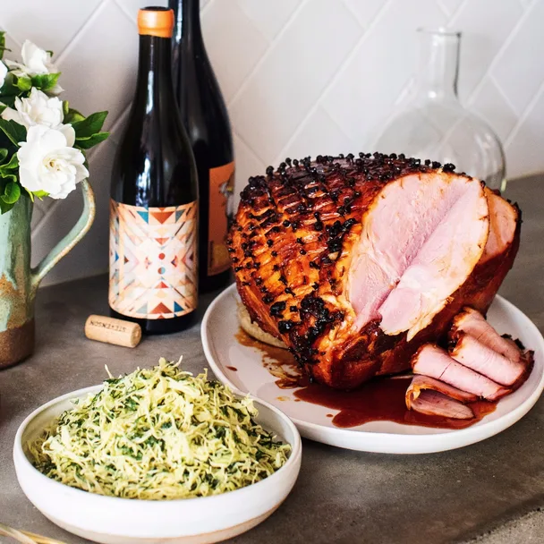 Sticky whisky and honey glazed ham with scores of cloves and a side slaw