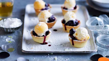 blueberry recipes of little blueberry pies topped with icecream